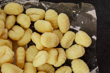 Gnocchi raw potato dough snack fresh delicious gourmet food background on the table  rustic food top view copy space vegetarian food