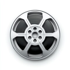 Obraz premium A silver-toned film reel, centrally positioned on a plain white background, displays a circular black filmstrip wound around it