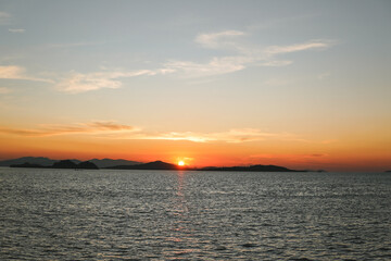 Obraz premium Beautiful scenery of sunset time in Labuan Bajo island, Indonesia.
