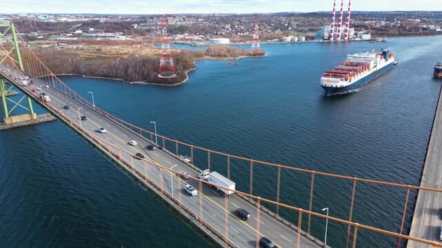 Aerial view of angus l macdonald bridge with ship in halifax harbor
