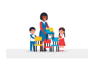 Building Dreams: A teacher helps children build a tower with colorful blocks, capturing the essence of growth and collaboration. 