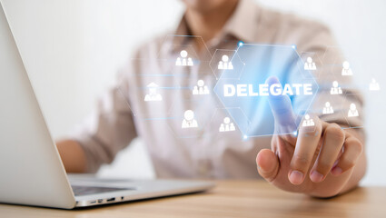 Person touching delegate button on digital interface with team icons business delegation