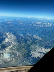 An aerial view over the French Italian Alps during a summer afternoon.