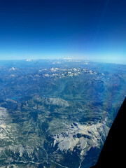 An aerial view over the French Italian Alps during a summer afternoon.