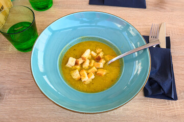Broccoli vegetable cream soup with croutons