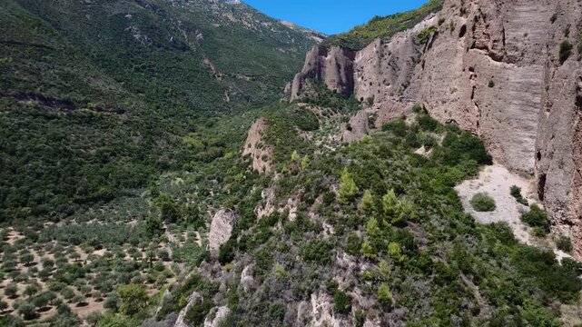 Rocky Greek mountains with olive fields in Mediterranean valley