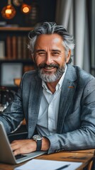 Fototapeta premium Smiling Grey Haired Businessman Laptop Work