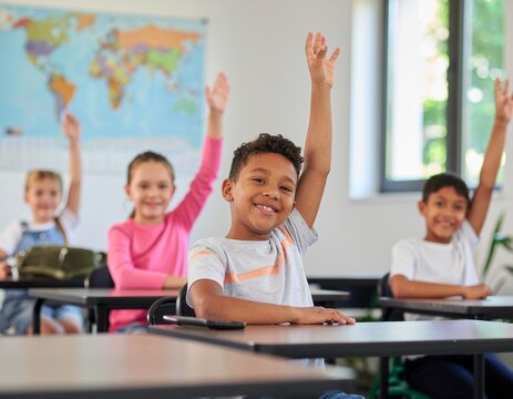 diverse group of happy school kids raising hands in classroom, authentic candid back to school moment