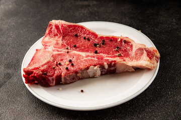 Raw steak T-bone fresh meat premium beef snack fresh delicious gourmet food background on the table rustic food top view copy space