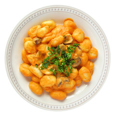 Gnocchi with a pumpkin, mushroom cream sauce. Autumn meal. Above view isolated on a white background.