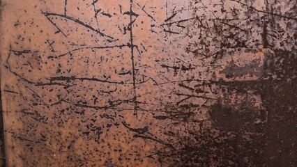 Abstract texture of scratched metal surface with dark paint stains and marks
