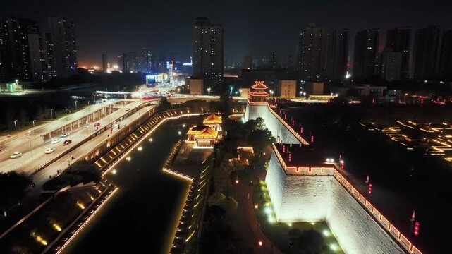 Aerial drone view of Corner Tower on ancient city wall of Xian city at night in Shanxi, China