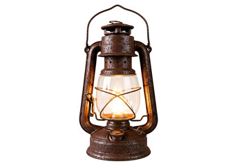 An antique, rusty kerosene lamp glows warmly against a dark background.
