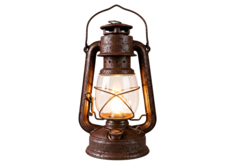An antique, rusty kerosene lamp glows warmly against a dark background.