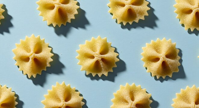 Farfalloni Pasta Pattern High-Angle Close-Up of Italian Butterfly Pasta on Light Blue Background