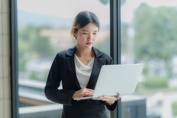 Fototapeta premium Determined female CEO working hard to boost sales and drive business growth.