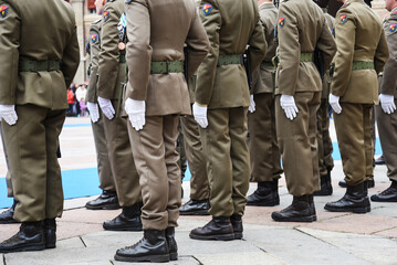 Soldiers lined up in the city square before performing the ceremony - The Army soldiers standing in row they are wearing and wear military uniforms - Concept of patriotism and defense of the nation