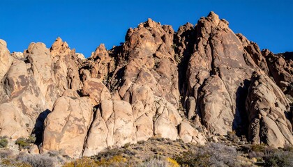 Fototapeta premium Rugged sandstone cliffs under a vibrant sky