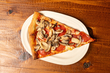 slice of pizza with mushrooms