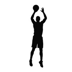 Basketball player shooting ball mid air silhouette