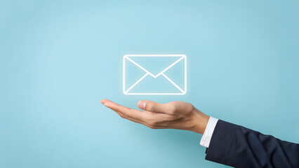 Hand Holding Email Icon on Blue Background