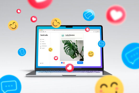 Social Media ads on laptop screen showing advertising example in a social network. Many emojis around it.
