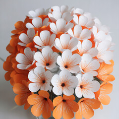 Obraz premium Orange and White Paper Flower Arrangement on White Background