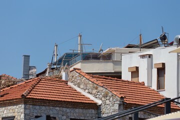 Tiled rooftops in a small town give way to a variety of styles and building materials in old Marmaris - Mugla - Turkey