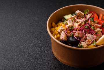 Bowl with chicken pieces, rice, tomatoes, peppers and microgreens. Bowl with chicken