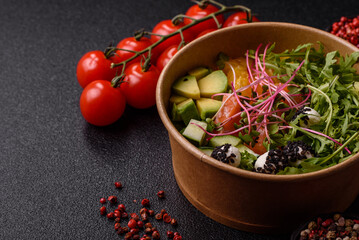 Bowl with salmon pieces, cheese, tomatoes, peppers and avocado. Salmon bowl