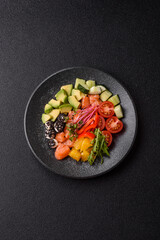 Bowl with salmon pieces, cheese, tomatoes, peppers and avocado. Salmon bowl