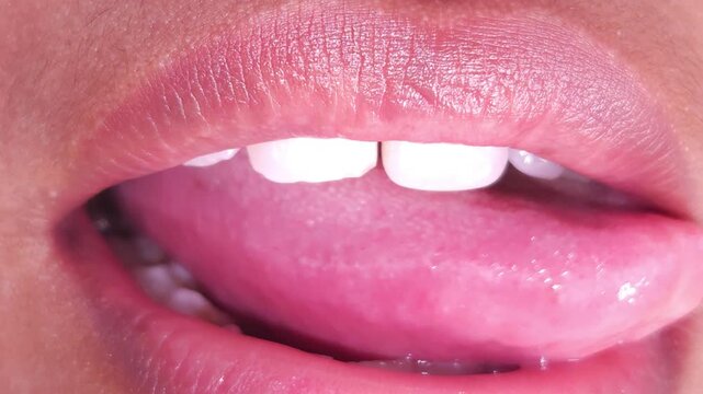 Close up Macro of Indian teenage girl lips doing various types of expressions. lift, Frown, grimace, moue, scowl, pout, Kiss, smooch, smack, peck, graze, caress, skim