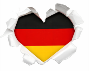 Heart shaped hole torn through paper, showing satin texture of flag of Germany, cut out
