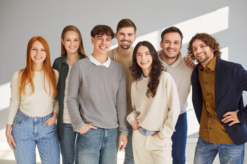 Obraz premium Group portrait of people in team, including students, coworkers, staff, and friends, showcasing crowd and teamwork on gray background in a professional setting with unity and collaboration.