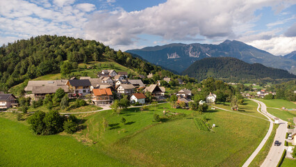 Fototapeta premium Aerial View of a Quaint Town Center with Red Roofs and Nearby River