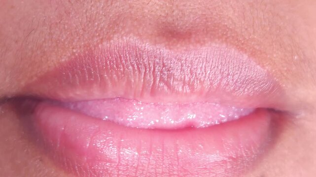 Close up Macro of Indian teenage girl lips doing various types of expressions. lift, Frown, grimace, moue, scowl, pout, Kiss, smooch, smack, peck, graze, caress, skim
