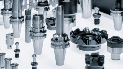 Industrial metalworking concept, milling cutter, metal cutter close up CNC cutters for metal. industry metal processing concept blue tone background