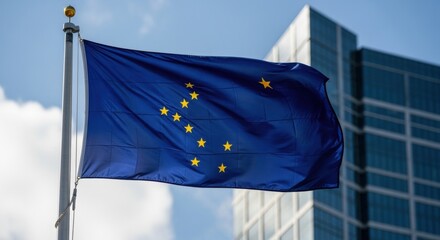 Alaska state flag with stars on blue field flying from a pole, building in background. Patriotism concept.