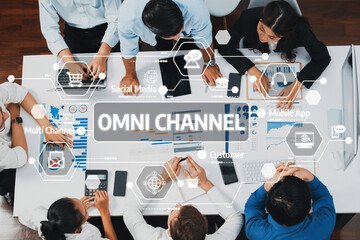 A diverse team engages in a strategic planning session focused on omni channel marketing, analyzing data and collaborating on innovative solutions to enhance customer engagement. Amity