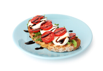 Delicious sandwich with mozzarella cheese, balsamic sauce, tomato and arugula isolated on white