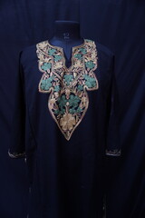 Kashmiri pheran displayed on a mannequin in Kashmir