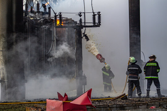 Firefighters extinguishing a blaze at an electrical substation