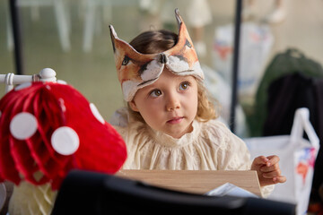 Cute Child in Fox Mask at Party