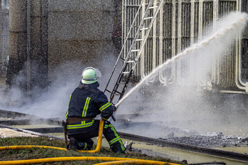 Firefighters extinguishing a blaze at an electrical substation