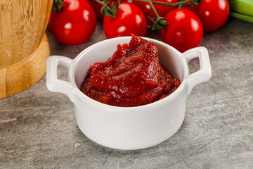 Red tomato paste in the bowl
