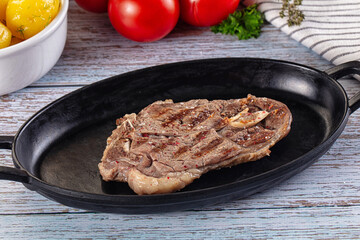Grilled lamb steak with bone