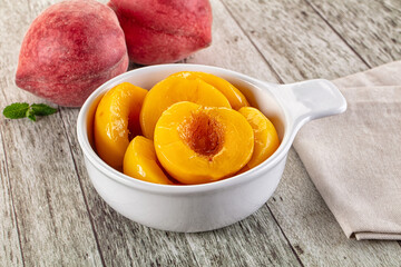 Sweet ripe yellow canned peaches
