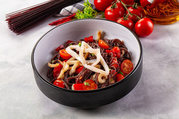 Black rice pasta with squid and tomato