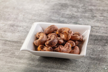 Unpeeled cashew nuts in the bowl