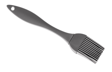 Gray silicone pastry brush resting on white background
